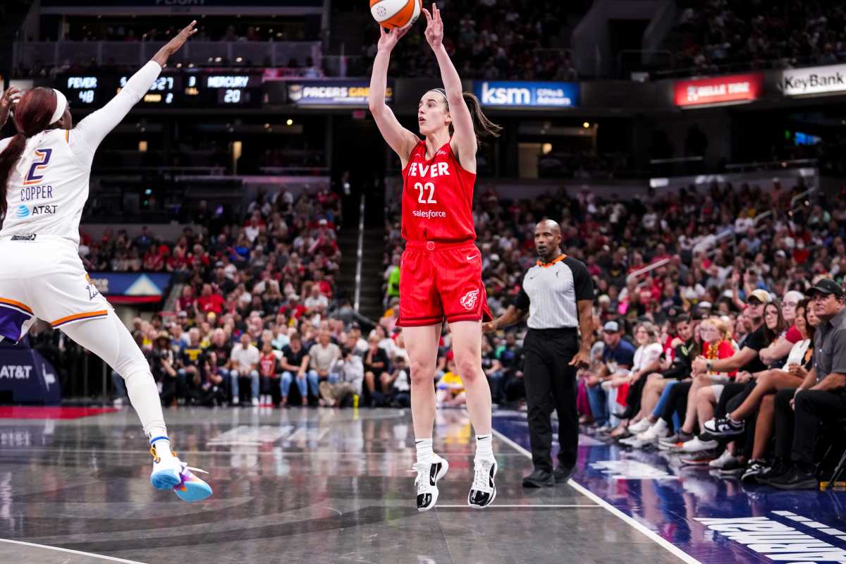 Indiana Fever guard Caitlin Clark (22) shoots a 3-pointer