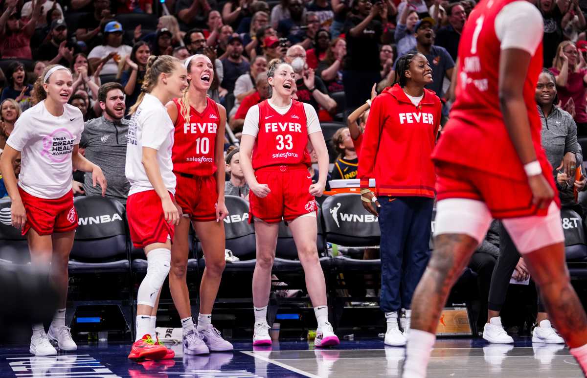 The Indiana Fever celebrate after Indiana Fever forward NaLyssa Smith (1) scored Friday, Aug. 16, 2024, during the game at Gainbridge Fieldhouse in Indianapolis.