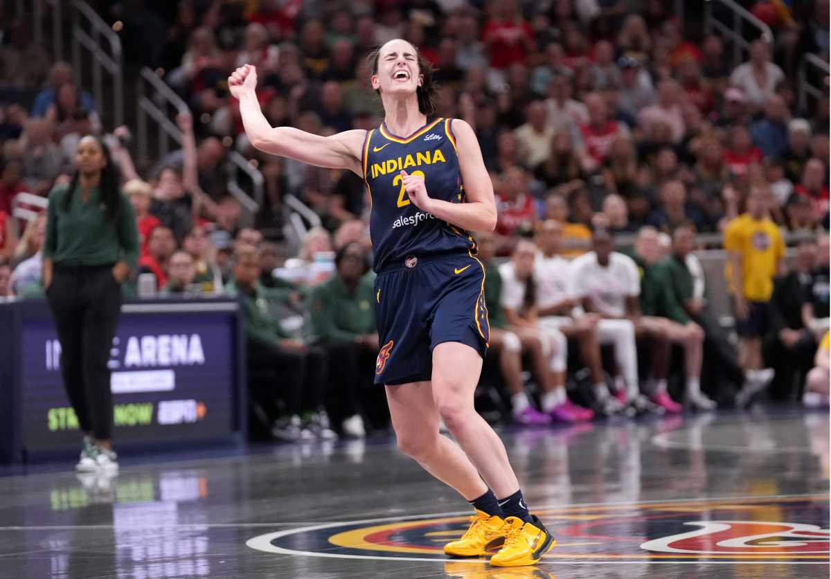 Indiana Fever guard Caitlin Clark (22) reacts as she misses a three-point field goal during the game against the Seattle Storm.