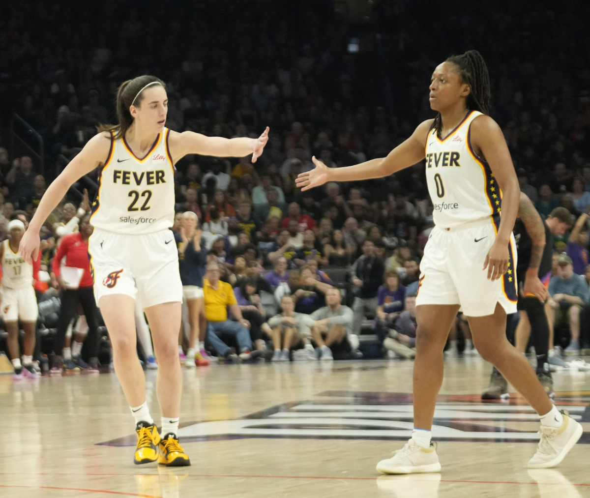 Indiana Fever guards Caitlin Clark (22) and Kelsey Mitchell (0)