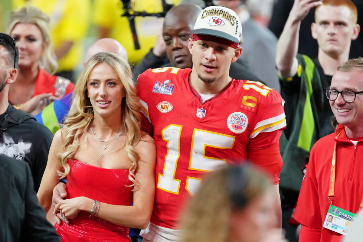 Kansas City Chiefs quarterback Patrick Mahomes and his wife Brittany Mahomes walk off the field after the 2024 Super Bowl.