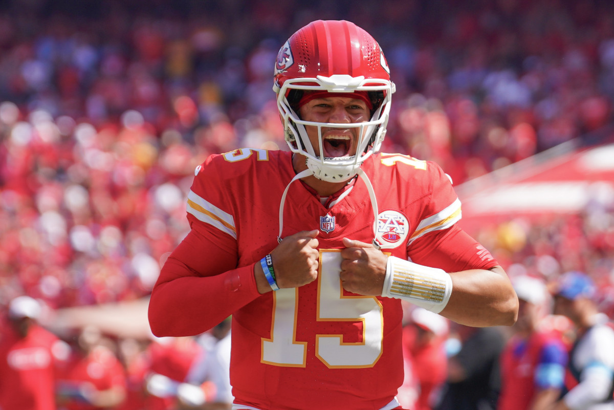 Kansas City Chiefs quarterback Patrick Mahomes (15) celebrates toward fans against the Detroit Lions prior to the game at GEHA Field at Arrowhead Stadium.