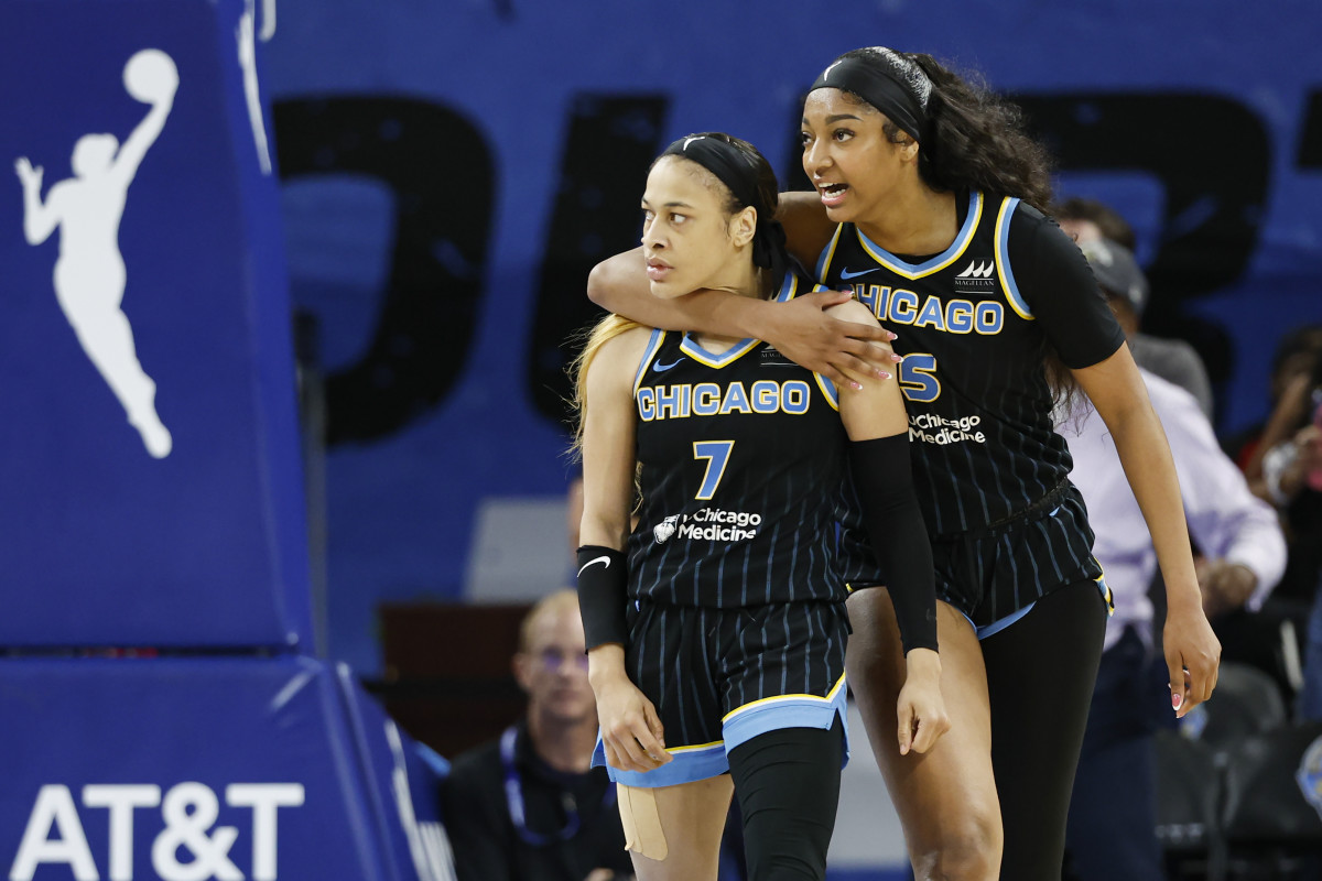 Chicago Sky guard Chennedy Carter (7) reacts next to forward Angel Reese (5).