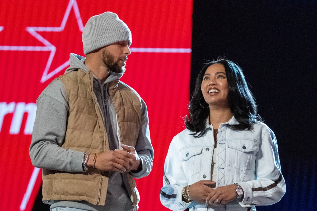 February 19, 2022; Cleveland, OH, USA; Golden State Warriors guard Stephen Curry (30) and wife Ayesha Curry (right) during the 2022 NBA All-Star Saturday Night at Rocket Mortgage Field House. Mandatory Credit: Kyle Terada-USA TODAY Sports  