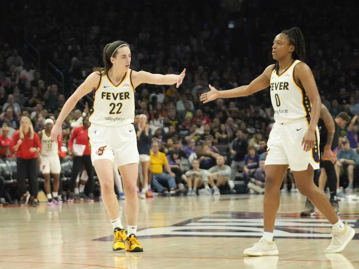 Indiana Fever guards Caitlin Clark and Kelsey Mitchell against the Phoenix Mercury.