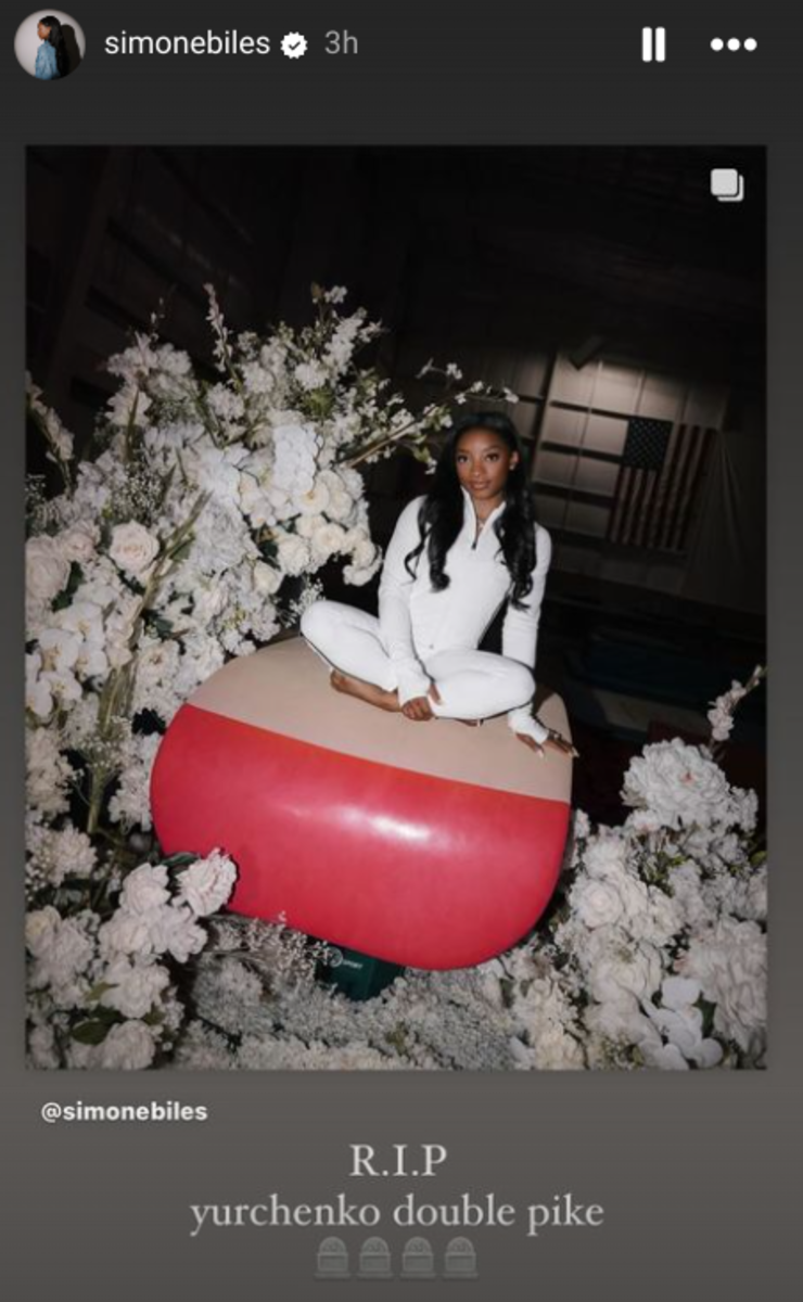 Simone Biles poses on a vault.