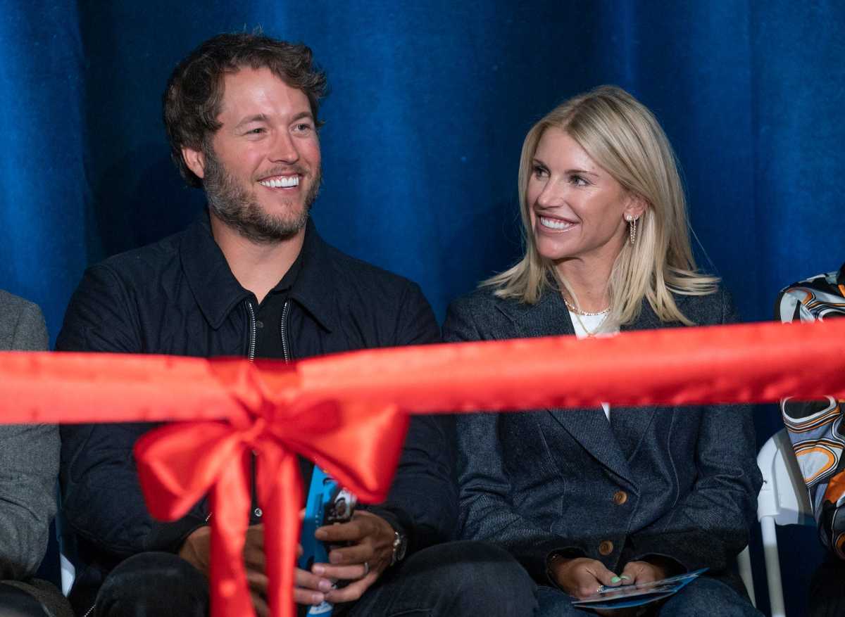 Mathew and Kelly Stafford share a laugh during speeches for the ribbon cutting of the Kelly and Matthew Stafford and Friends Education Center at the S.A.Y Detroit Play Center in Detroit