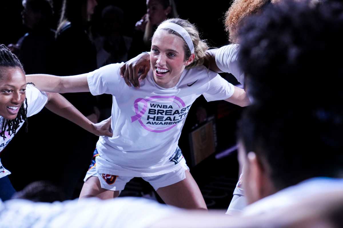 Indiana Fever guard Lexie Hull (10) smiles in a huddle Wednesday, Aug. 28, 2024, during a game between the Indiana Fever and the Connecticut Sun at Gainbridge Fieldhouse in Indianapolis. The Fever defeated the Sun, 84-80.