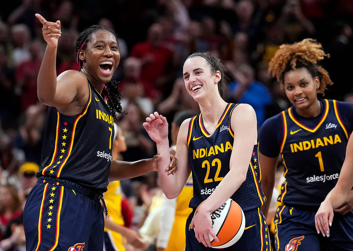 Indiana Fever forward Aliyah Boston (7) celebrates with Indiana Fever guard Caitlin Clark (22)