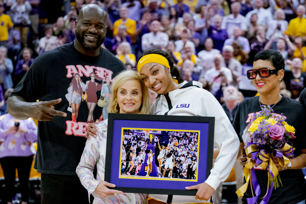 Mar 3, 2024; Baton Rouge, Louisiana, USA; LSU Lady Tigers forward Angel Reese takes a photo for senior night with former LSU player and NBA champion Shaquille O'Neal, LSU Lady Tigers head coach Kim Mulkey, and Reese’s mother Angel Webb against the Kentucky Wildcats at Pete Maravich Assembly Center.