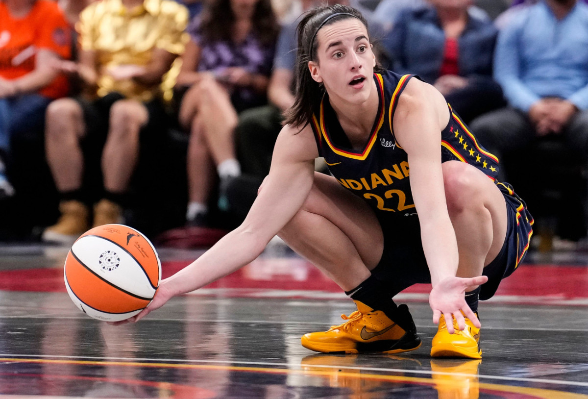 Indiana Fever guard Caitlin Clark kneels down in frustration during a game at Gainbridge Fieldhouse on September 4, 2024.