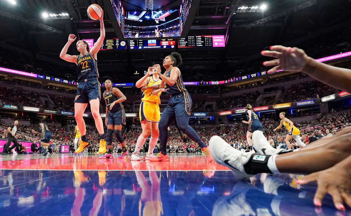 Indiana Fever guard Caitlin Clark (22) grabs a rebound against the Los Angeles Sparks.