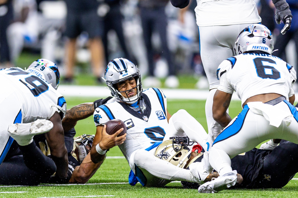 Sep 8, 2024; New Orleans, Louisiana, USA; Carolina Panthers quarterback Bryce Young (9) is tackled as he scrambles out the pocket by New Orleans Saints cornerback Alontae Taylor (1) during the second half at Caesars Superdome.