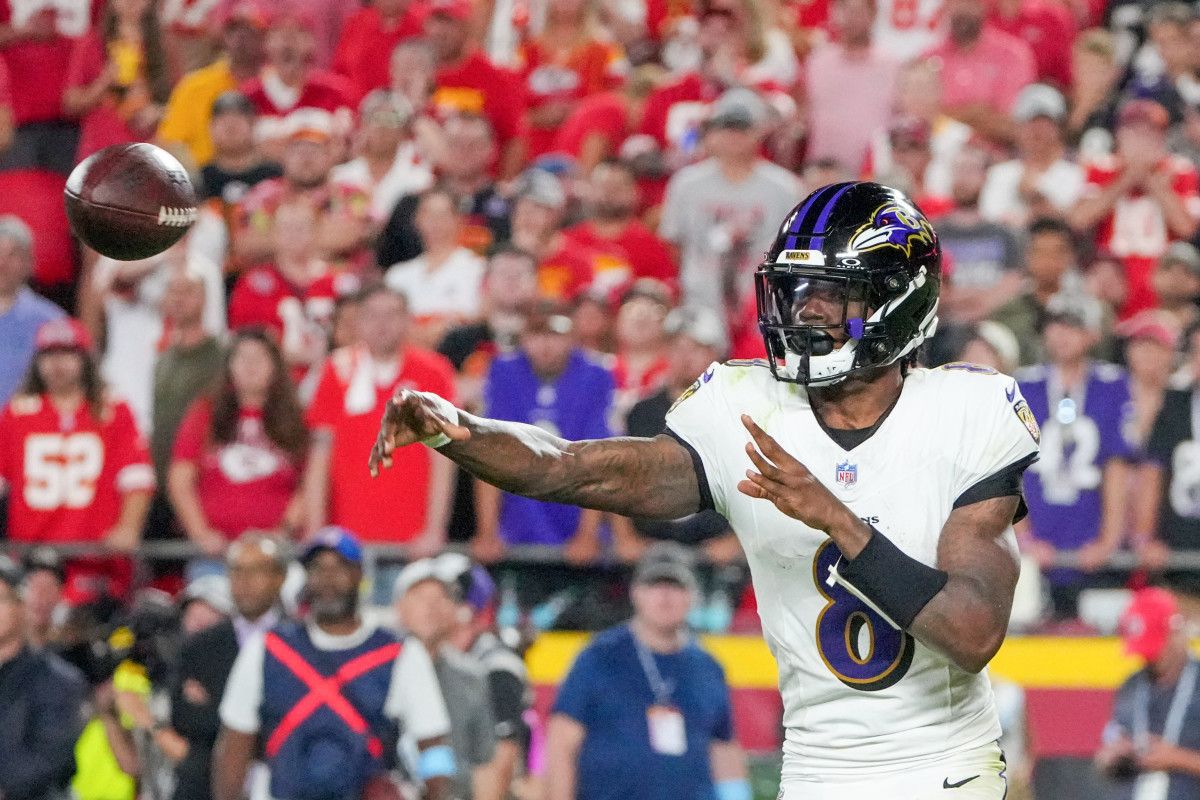 Baltimore Ravens quarterback Lamar Jackson (8) throws a pass against the Kansas City Chiefs during the second half at GEHA Field at Arrowhead Stadium.