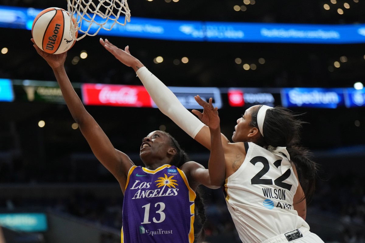 LA Sparks forward Chiney Ogwumike (13) shoots the ball against Las Vegas Aces forward A'ja Wilson (22).