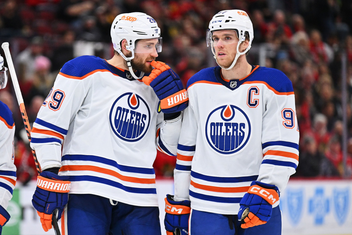 Edmonton Oilers forward Leon Draisaitl (29) and forward Connor McDavid (97) talk before a face off.