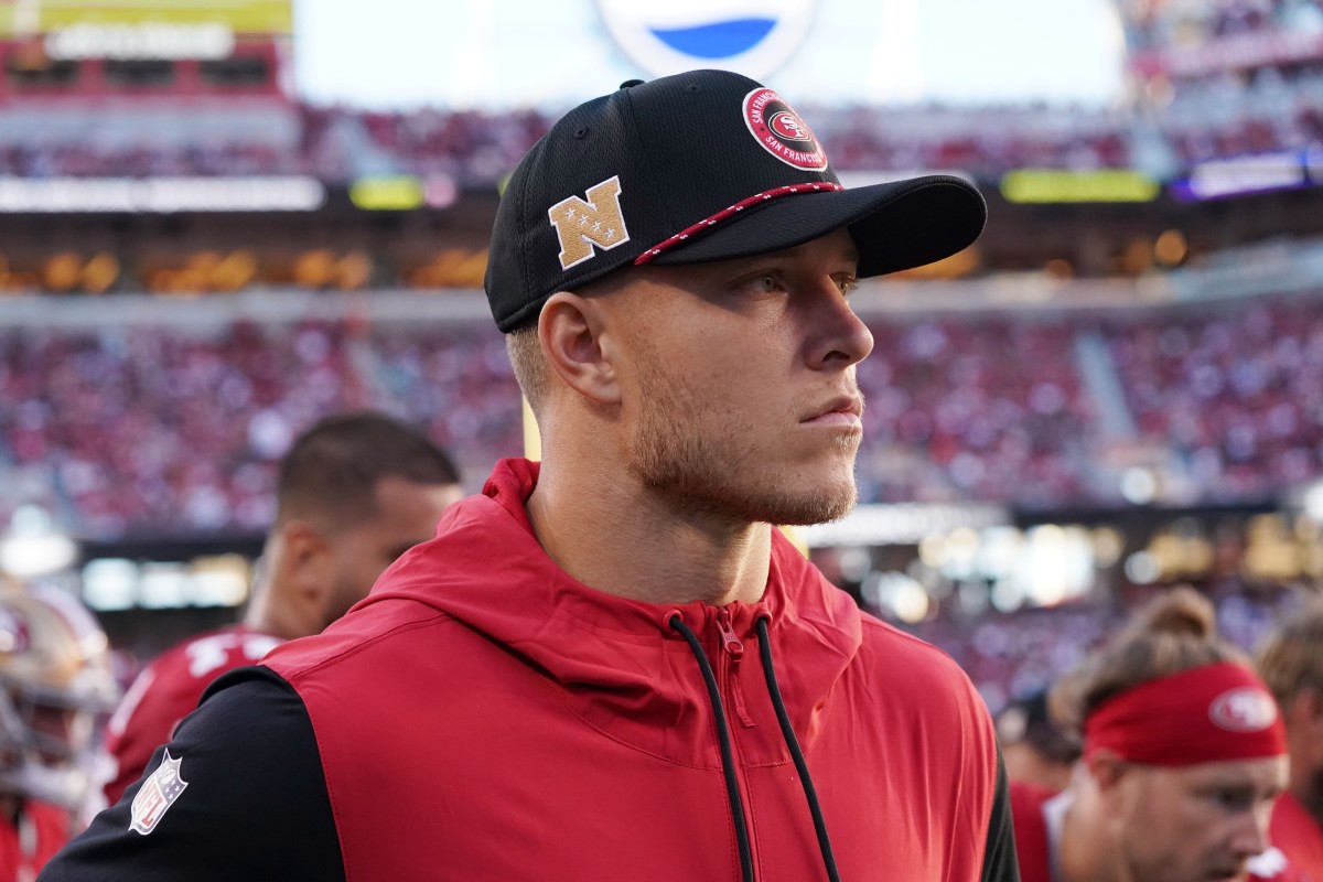 Santa Clara, California, USA; San Francisco 49ers running back Christian McCaffrey (23) watches from the sideline due to injury during the second quarter against the New York Jets at Levi's Stadium - David Gonzales-Imagn Images