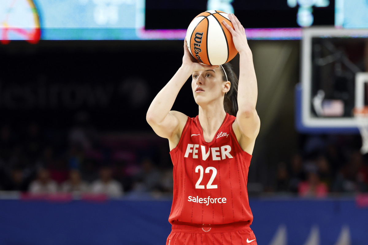 Indiana Fever guard Caitlin Clark (22) shoots against the Chicago Sky.