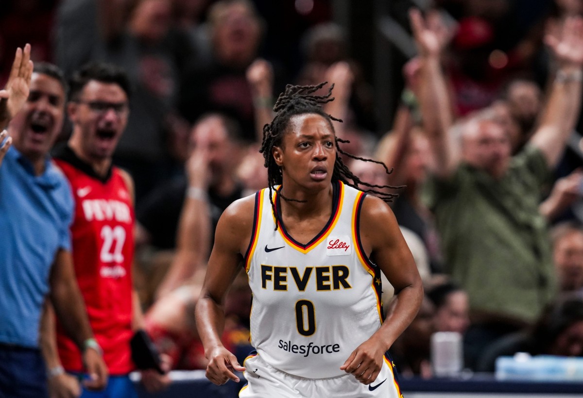 Indiana Fever guard Kelsey Mitchell (0) runs down the court after scoring a 3-pointer.