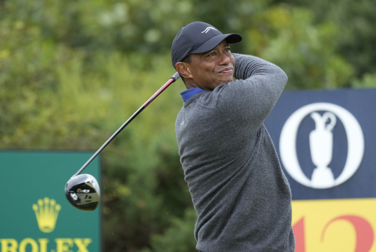 Tiger Woods hits his tee shot on the 12th hole during the first round of the Open Championship golf tournament at Royal Troon.