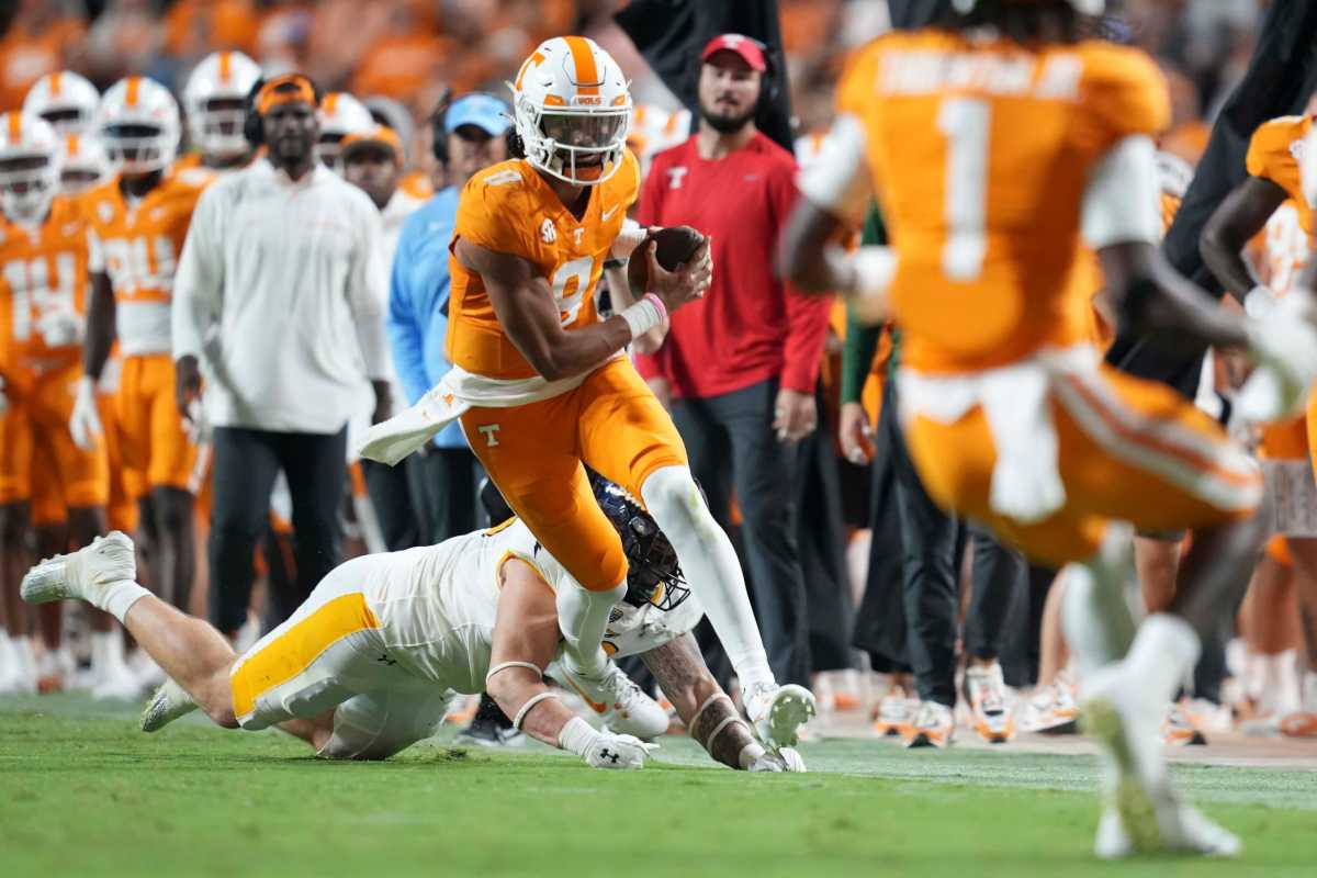 Tennessee Volunteers quarterback Nico Iamaleava runs down the sideline.