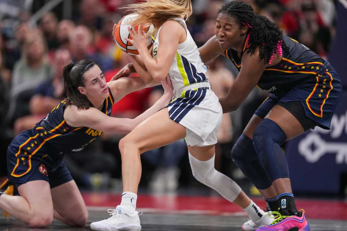 Indiana Fever guard Caitlin Clark and center Aliyah Boston in action against the Dallas Wings.