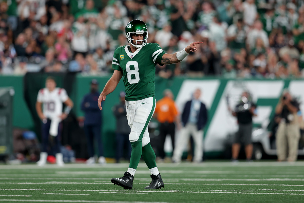 Sep 19, 2024; East Rutherford, New Jersey, USA; New York Jets quarterback Aaron Rodgers (8) reacts during the second quarter against the New England Patriots at MetLife Stadium.