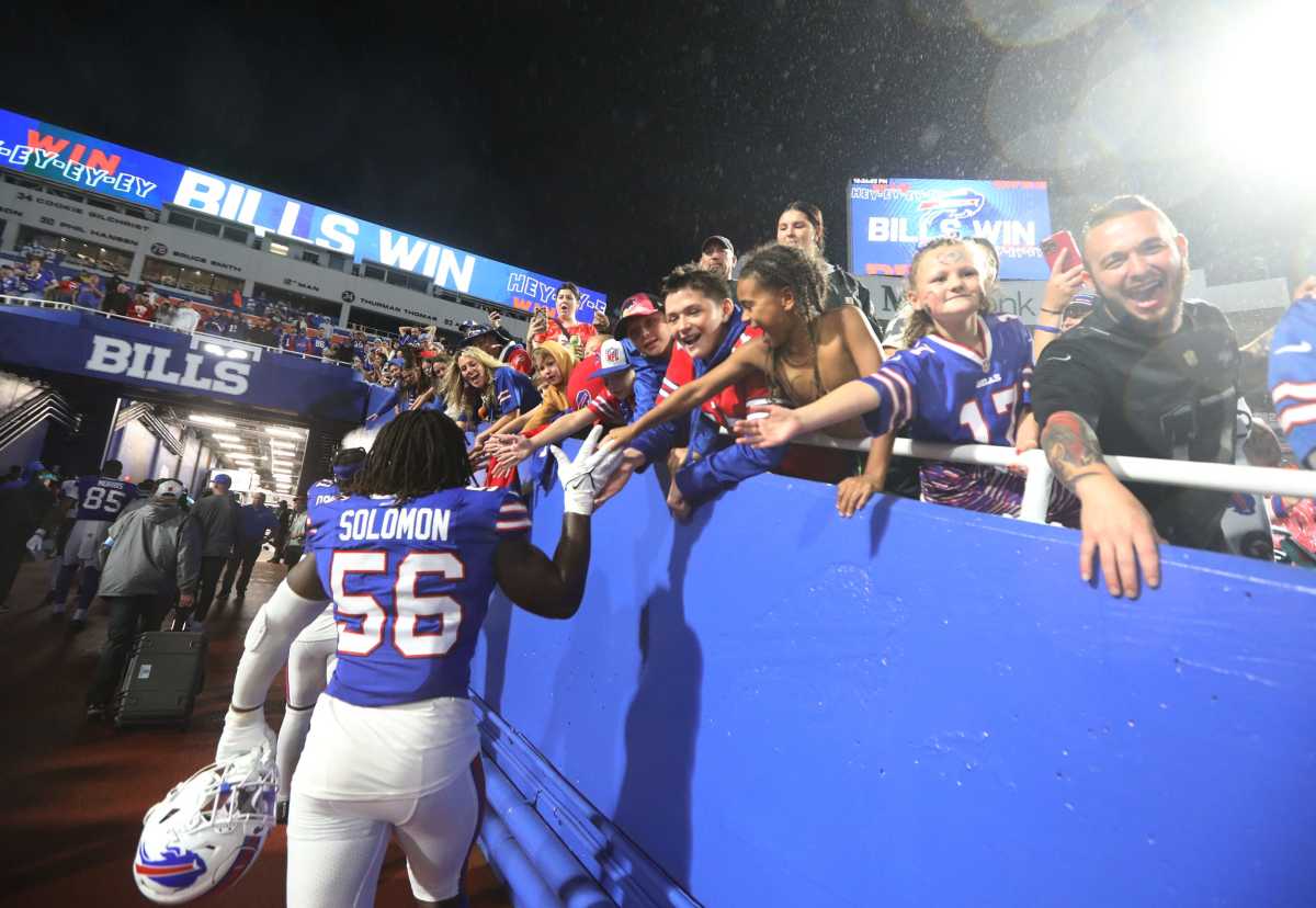 Bills Javon Solomon high-fives fans as he heads to the locker room after their win over the Jacksonville Jaguars at Highmark Stadium in Orchard Park on Sept. 23, 2024.