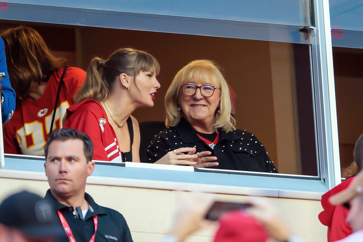 Oct 12, 2023; Kansas City, Missouri, USA; Grammy award winning artist Taylor Swift watches Kansas City Chiefs take the field along with Kansas City Chiefs tight end Travis Kelce (87) mom Donna Kelce prior to the game against the Denver Broncos at GEHA Field at Arrowhead Stadium.