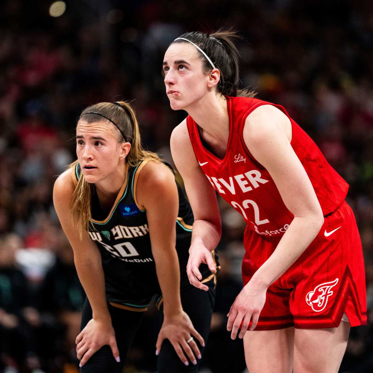 New York Liberty guard Sabrina Ionescu (20) and Indiana Fever guard Caitlin Clark (22).