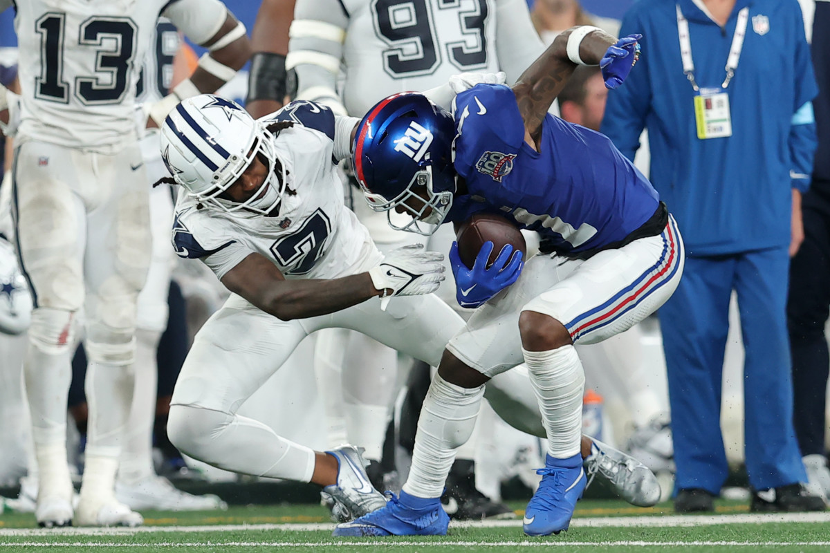 Cowboys cornerback Trevon Diggs tackles Giants wide receiver Malik Nabers.