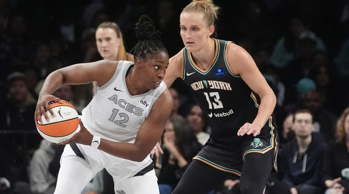 Las Vegas Aces guard Chelsea Gray controls the ball as New York Liberty forward Leonie Fiebich defends during Game 1 of the WNBA semifinals at Barclays Center on Sept. 29, 2024.