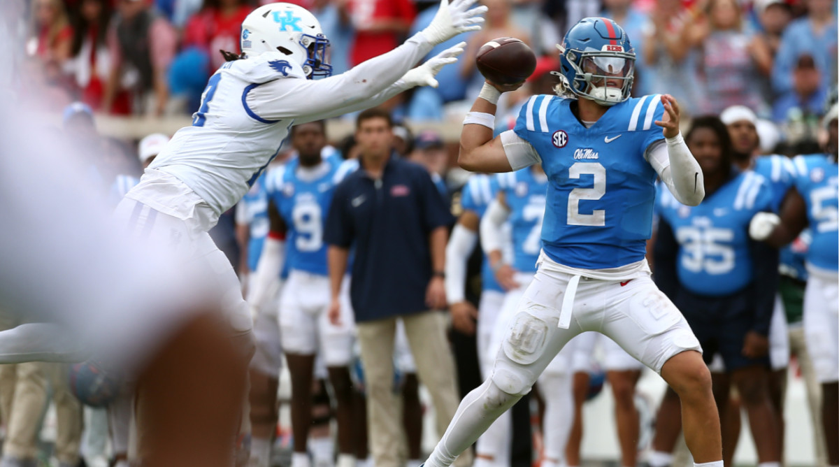 Sep 28, 2024; Oxford, Mississippi, USA; Mississippi Rebels quarterback Jaxson Dart (2) attempts to pass the ball as Kentucky Wildcats linebacker J.J. Weaver (13) rushes during the second half at Vaught-Hemingway Stadium.