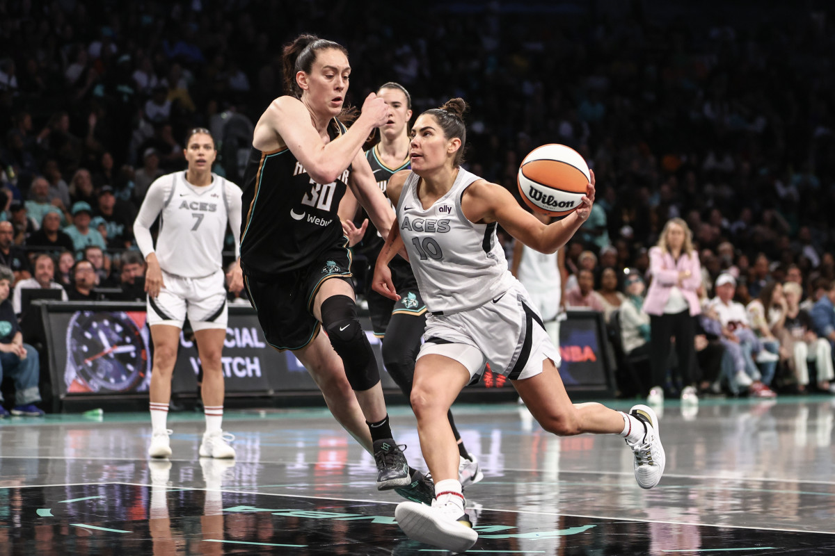 Las Vegas Aces guard Kelsey Plum drives past New York Liberty forward Breanna Stewart.