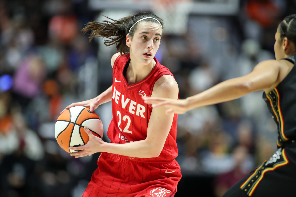 Indiana Fever guard Caitlin Clark (22) possesses the ball during the first half against the Connecticut Sun during game two of the first round of the 2024 WNBA Playoffs at Mohegan Sun Arena.