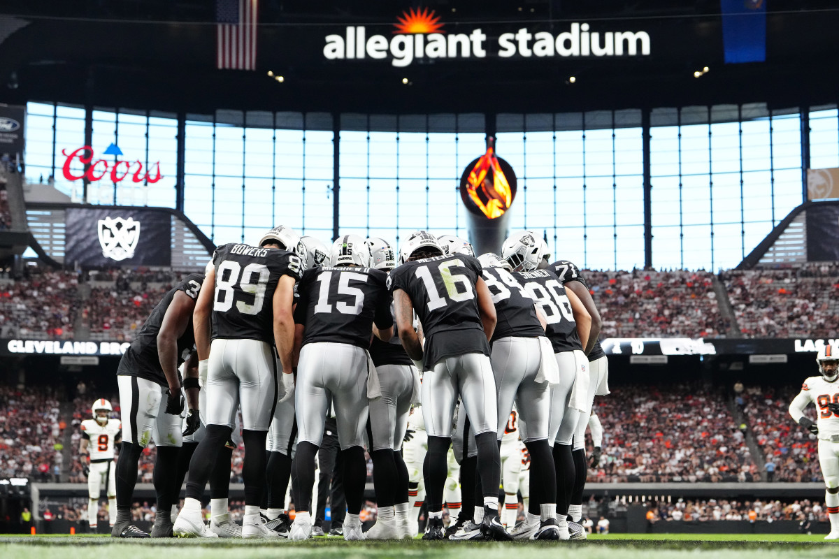 The Las Vegas Raiders huddle up before a play against the Cleveland Browns during the third quarter at Allegiant Stadium.