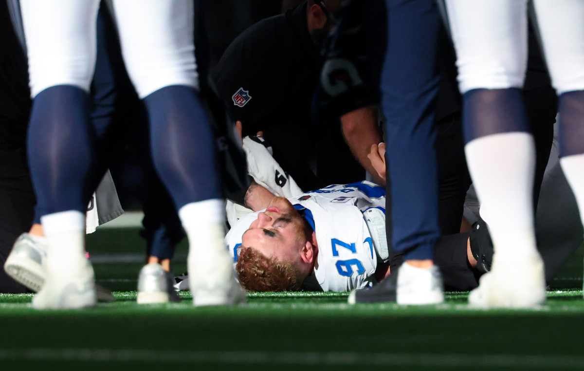 Oct 13, 2024; Arlington, Texas, USA; Detroit Lions defensive end Aidan Hutchinson (97) lays injured during the second half against the Dallas Cowboys at AT&T Stadium.