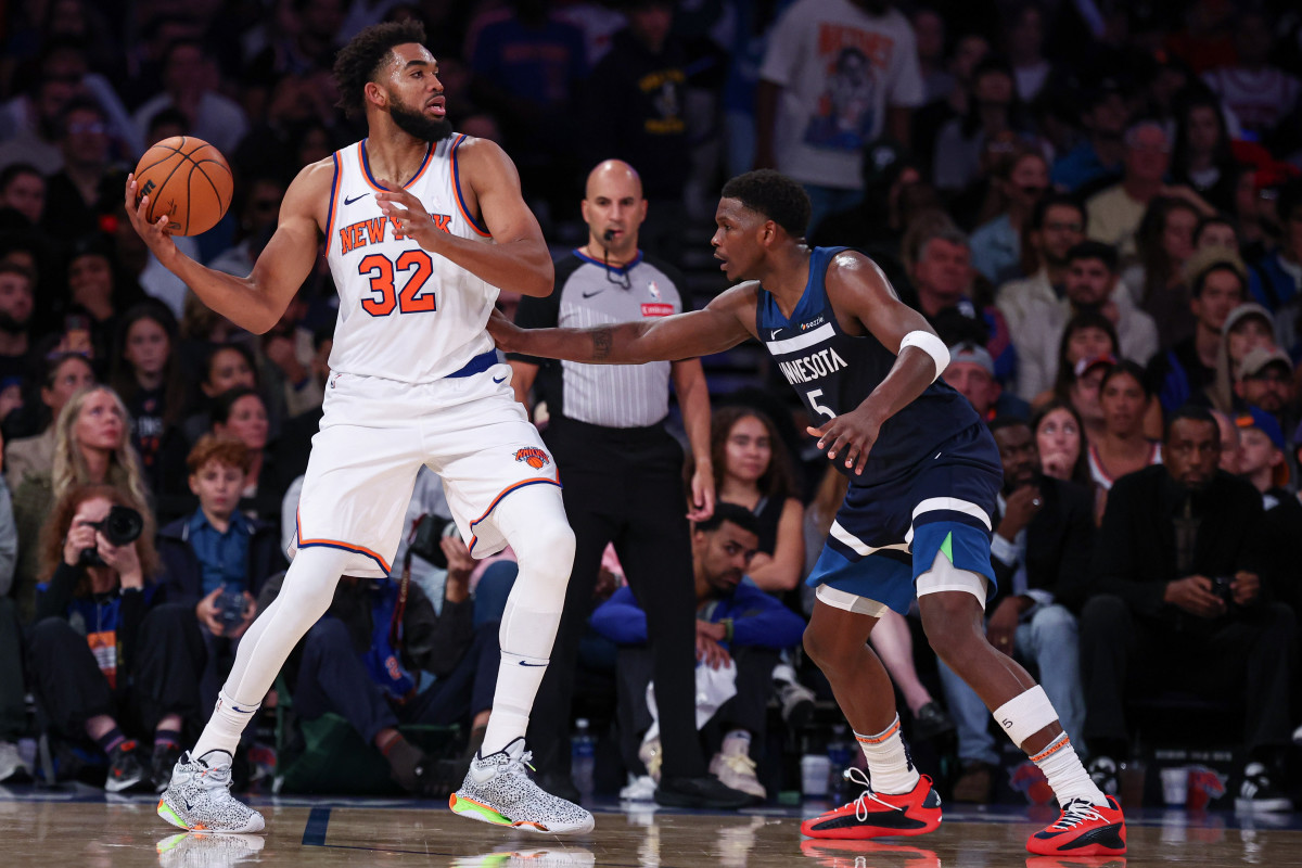 Oct 13, 2024; New York, New York, USA; New York Knicks center Karl-Anthony Towns (32) looks to pass as Minnesota Timberwolves guard Anthony Edwards (5) defends during the second half at Madison Square Garden.