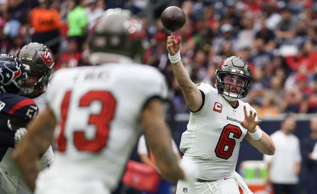 Nov 5, 2023; Houston, Texas, USA; Tampa Bay Buccaneers quarterback Baker Mayfield (6) passes to wide receiver Mike Evans (13) against the Houston Texans in the first quarter at NRG Stadium. Mandatory Credit: Thomas Shea-USA TODAY Sports