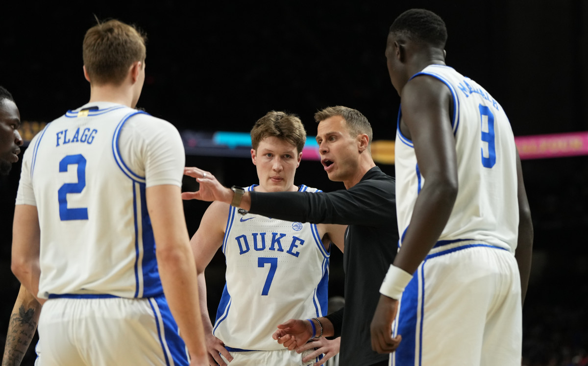 Duke Blue Devils head coach Jon Scheyer talks strategy with his players ahead of the Final Four vs. Houston.