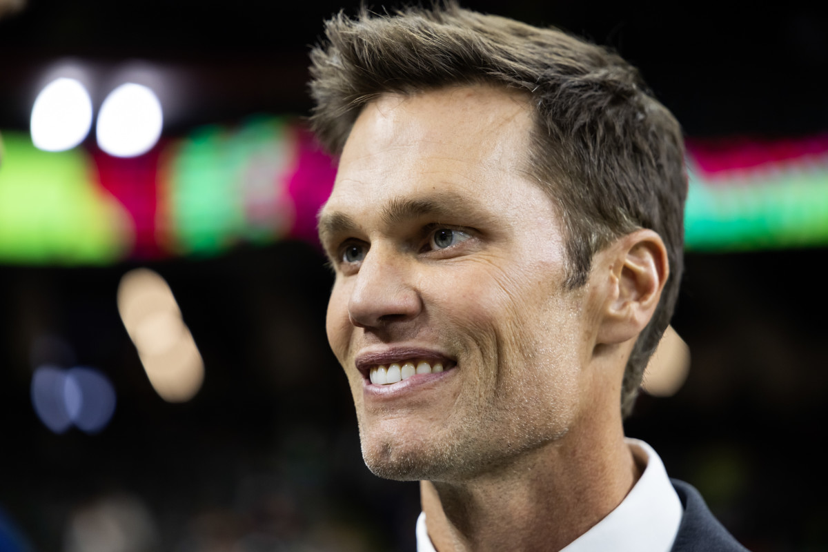 Fox Sports announcer and former NFL quarterback Tom Brady on the field before Super Bowl LIX.