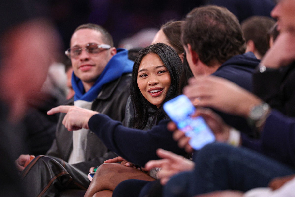 Gymnast Suni Lee sits courtside during the second half of the NBA game between the New York Knicks and the Phoenix Suns