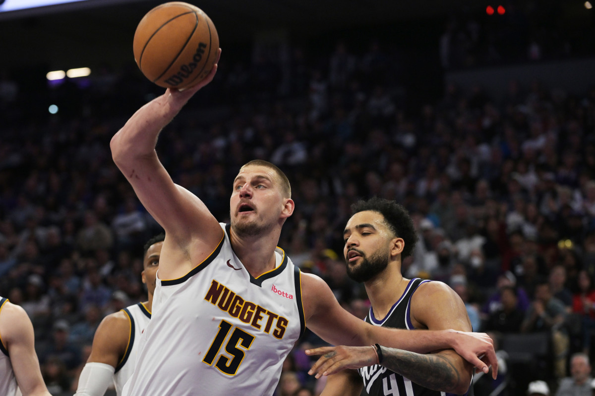 Nuggets center Nikola Jokic rebounds the ball against the Kings.