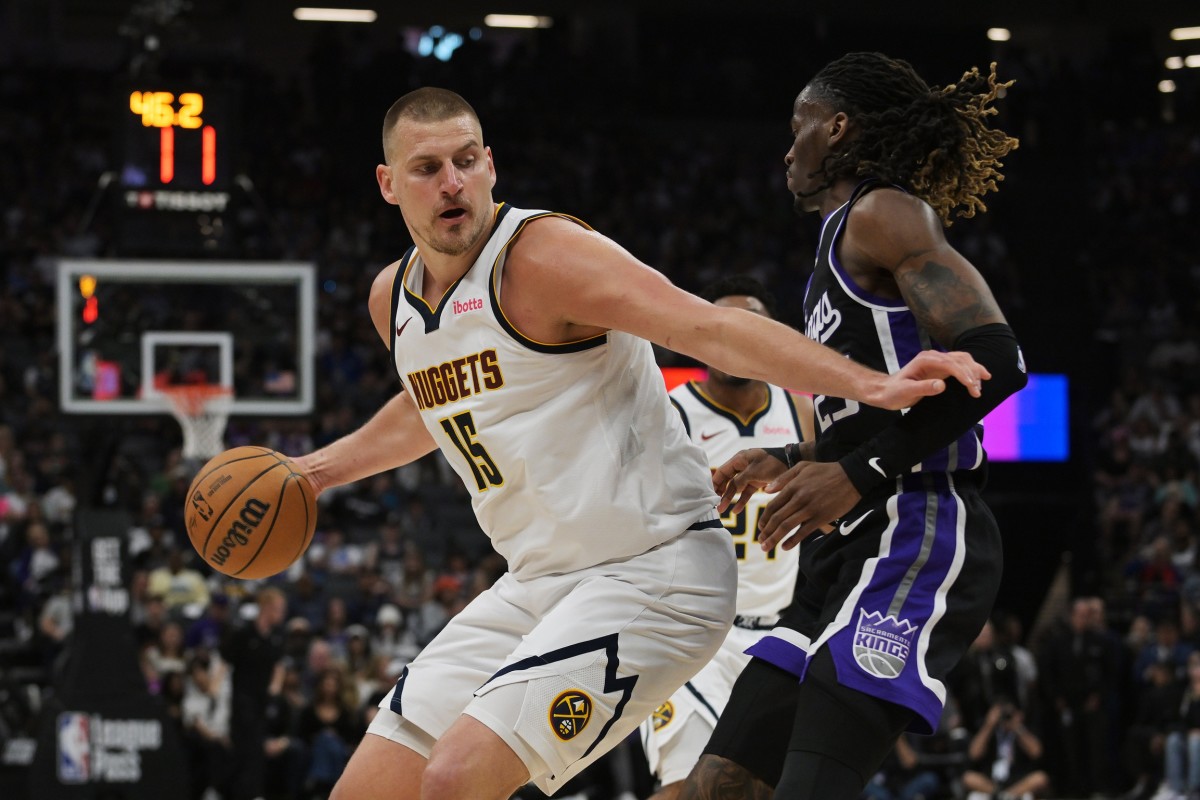 Denver Nuggets center Nikola Jokić controls the ball as Sacramento Kings guard Keon Ellis defends at Golden 1 Center on April 9, 2025.