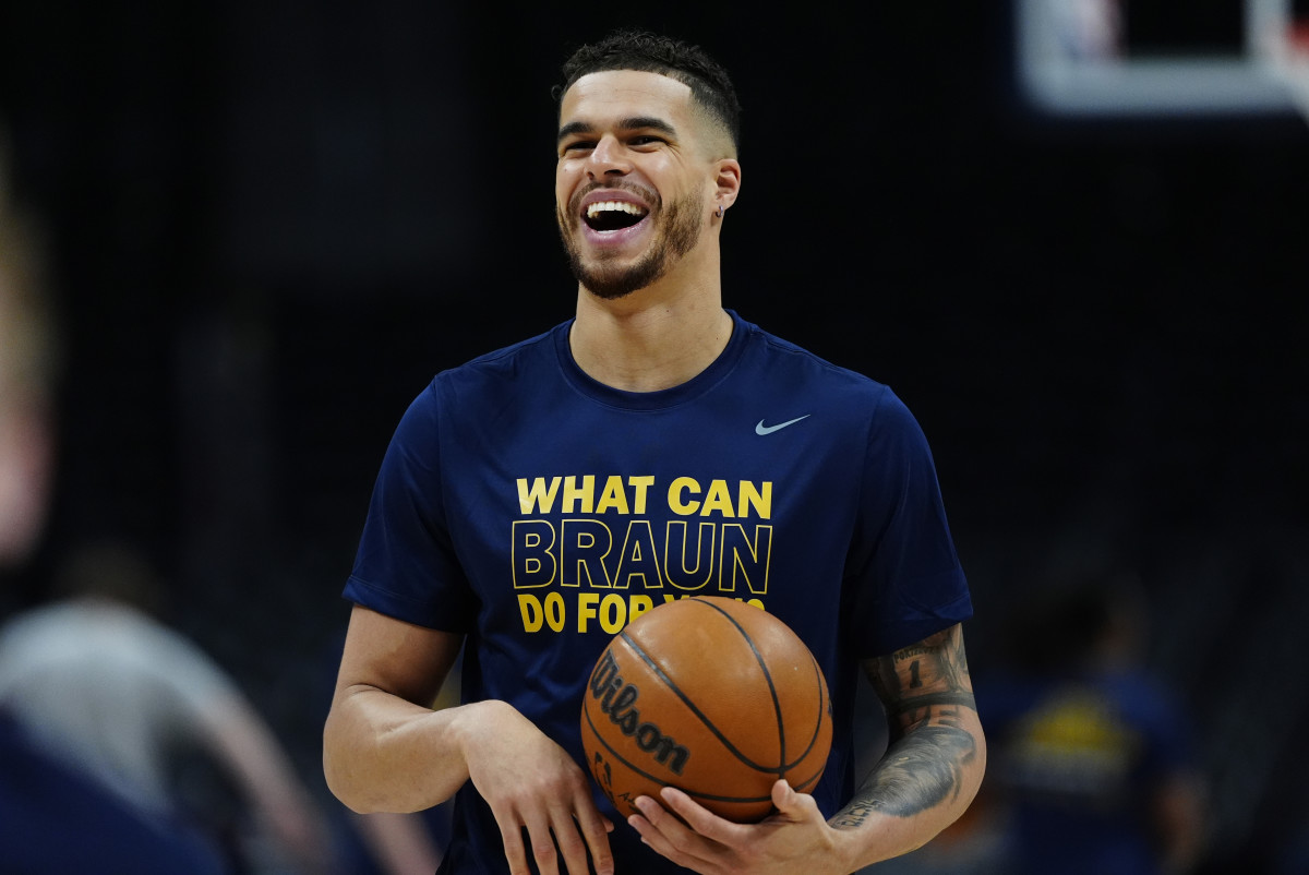Apr 11, 2025; Denver, Colorado, USA; Denver Nuggets forward Michael Porter Jr. (1) reacts before the game against the Memphis Grizzlies at Ball Arena. Mandatory Credit: Ron Chenoy-Imagn Images