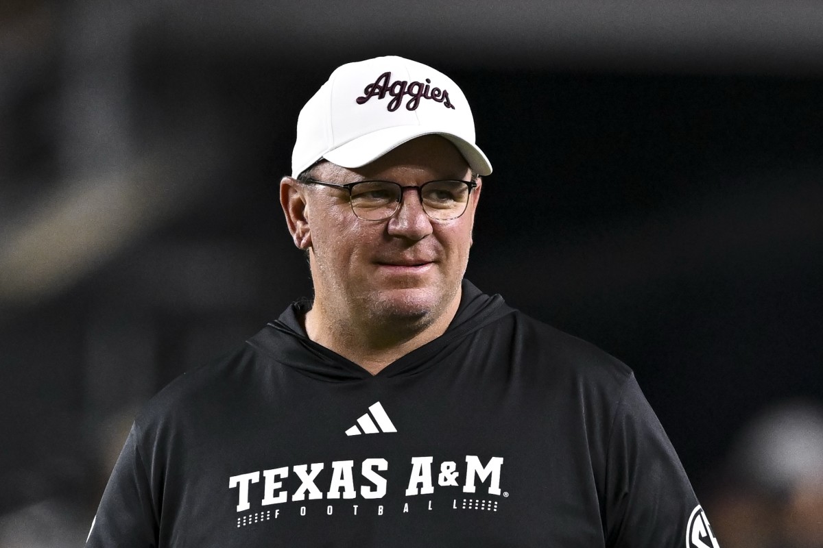 Texas A&M Aggies head coach Mike Elko walks on the field prior to the game against the New Mexico State Aggies at Kyle Field.