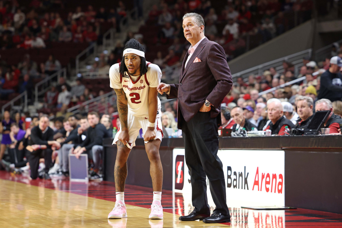 Arkansas Razorbacks guard Boogie Fland and head coach John Calipari