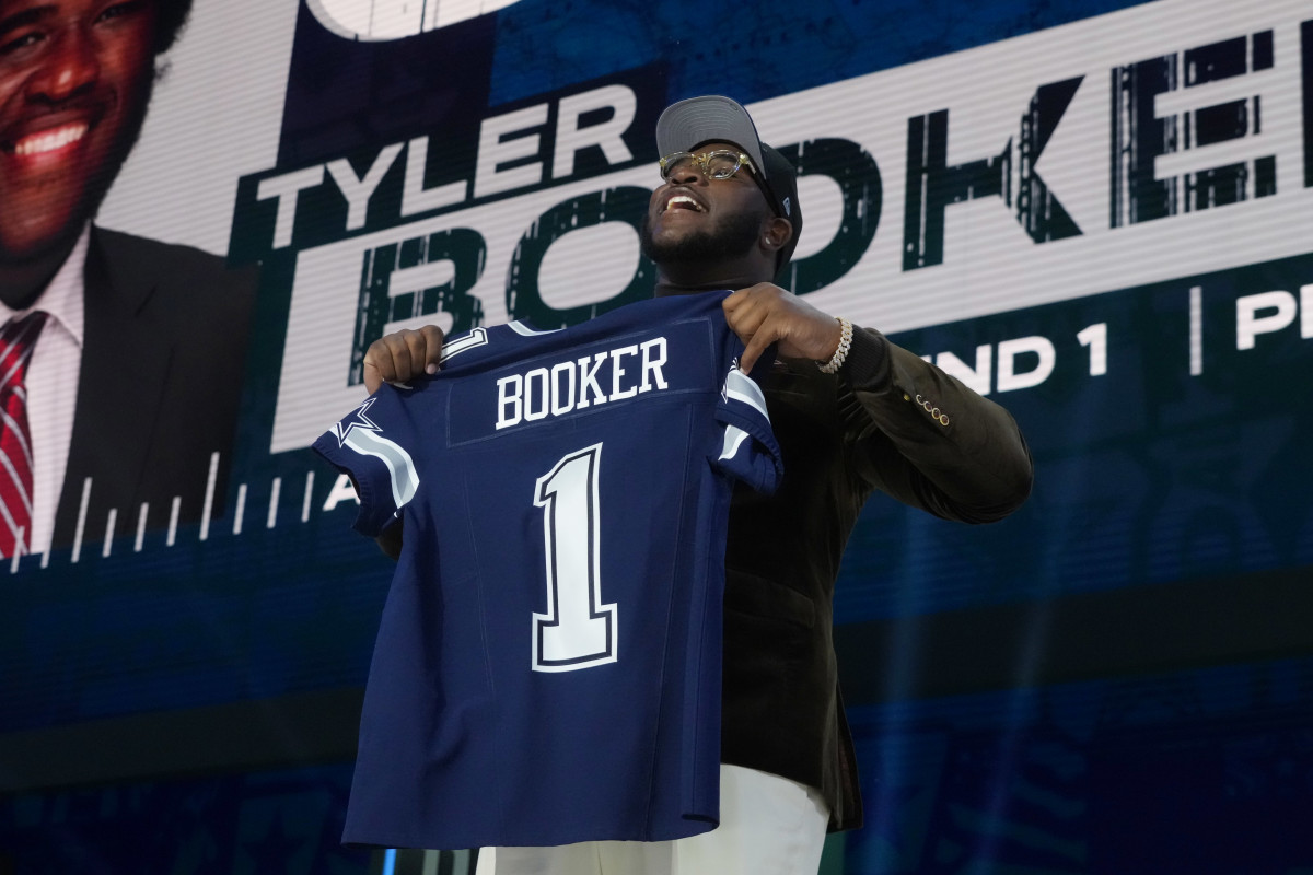 Alabama offensive lineman Tyler Booker is selected by the Dallas Cowboys.
