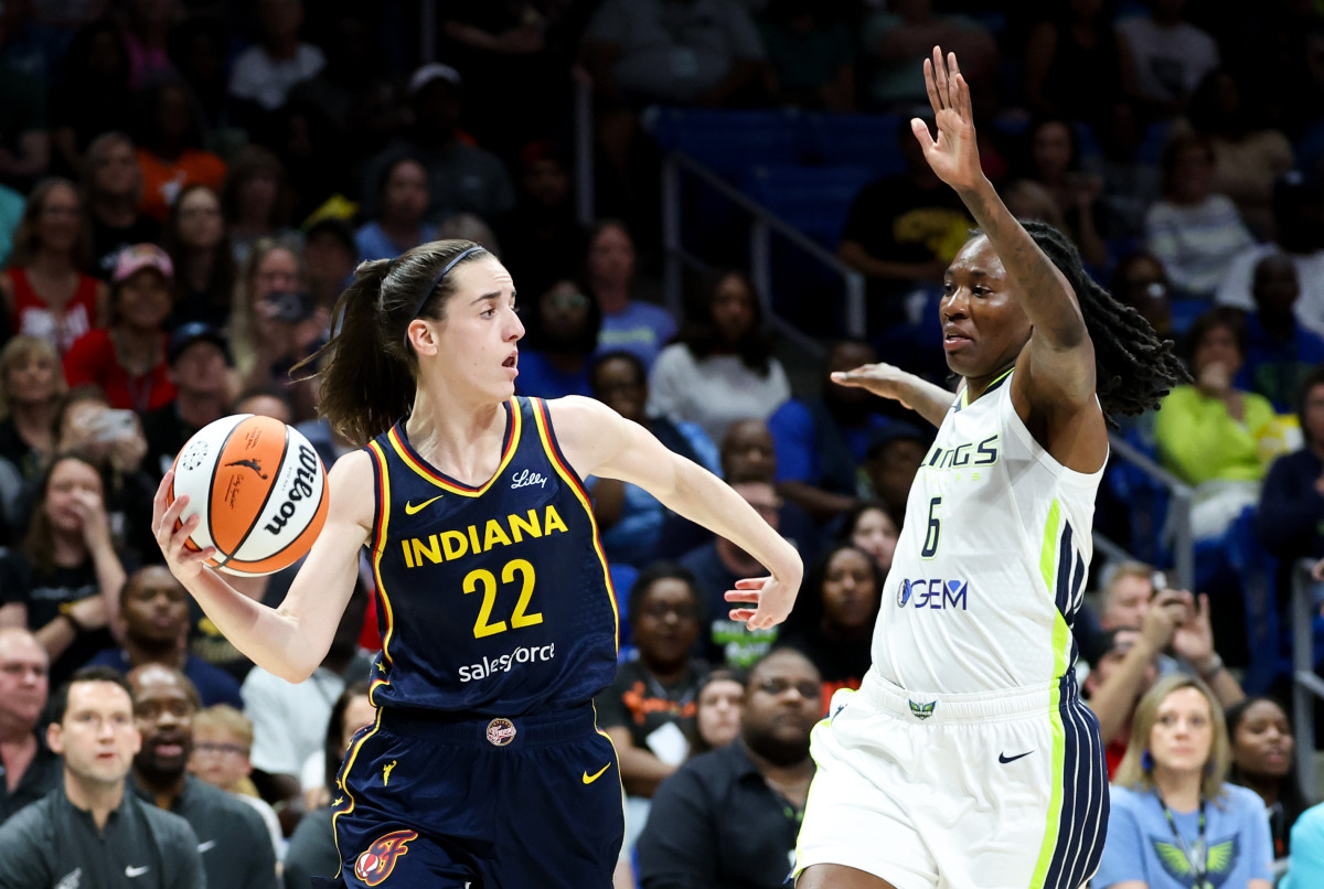 Indiana Fever guard Caitlin Clark (22) passes the ball.