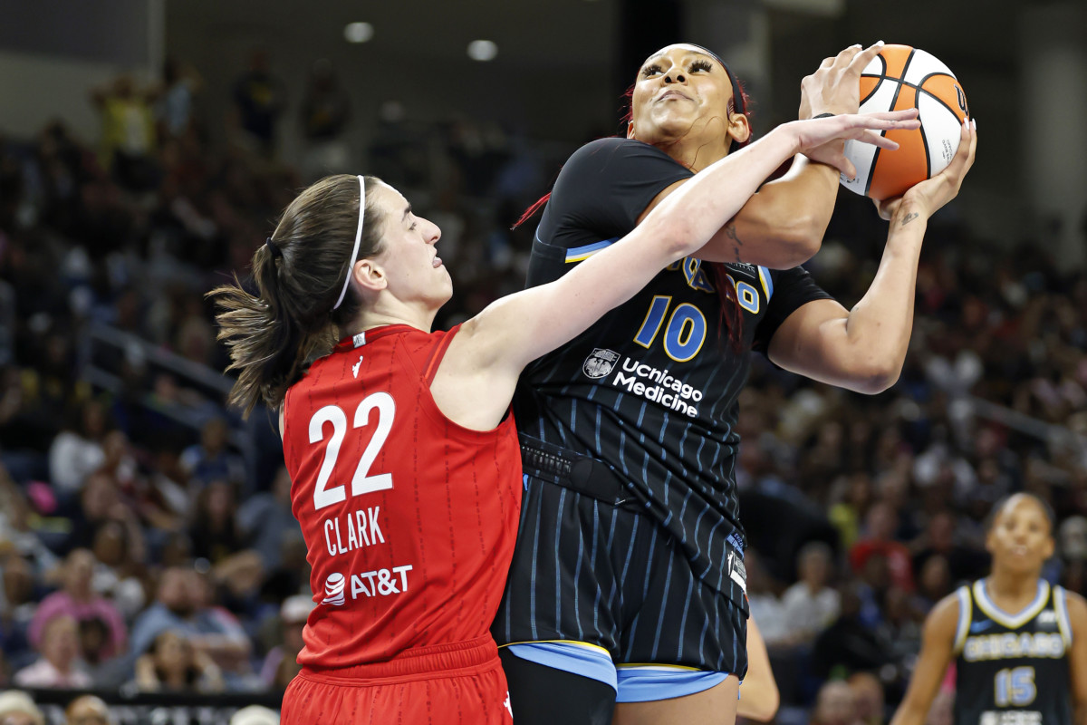 Indiana Fever guard Caitlin Clark (22) fouls Chicago Sky center Kamilla Cardoso (10) during the second half at Wintrust Arena.